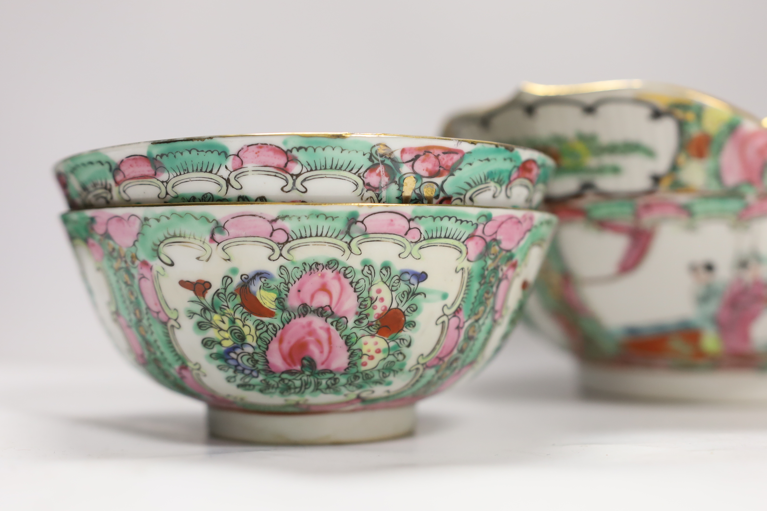 A Chinese famille rose large serving bowl and four smaller bowls, larger bowl 25cm diameter